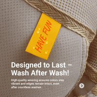 Yellow Have Fun woven tag beneath a beige fabric strap, with water droplets and a Designed to Last washing message.